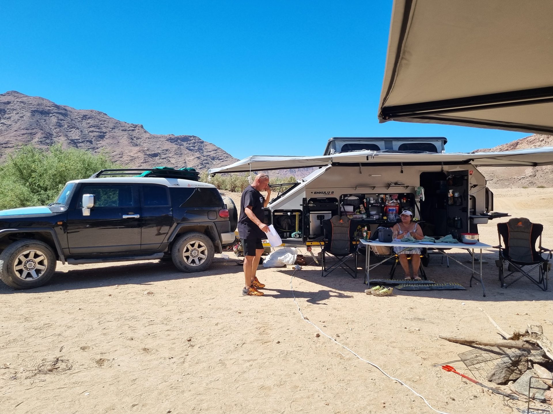 Enkulu 2 set up for camp beside the tow vehicle