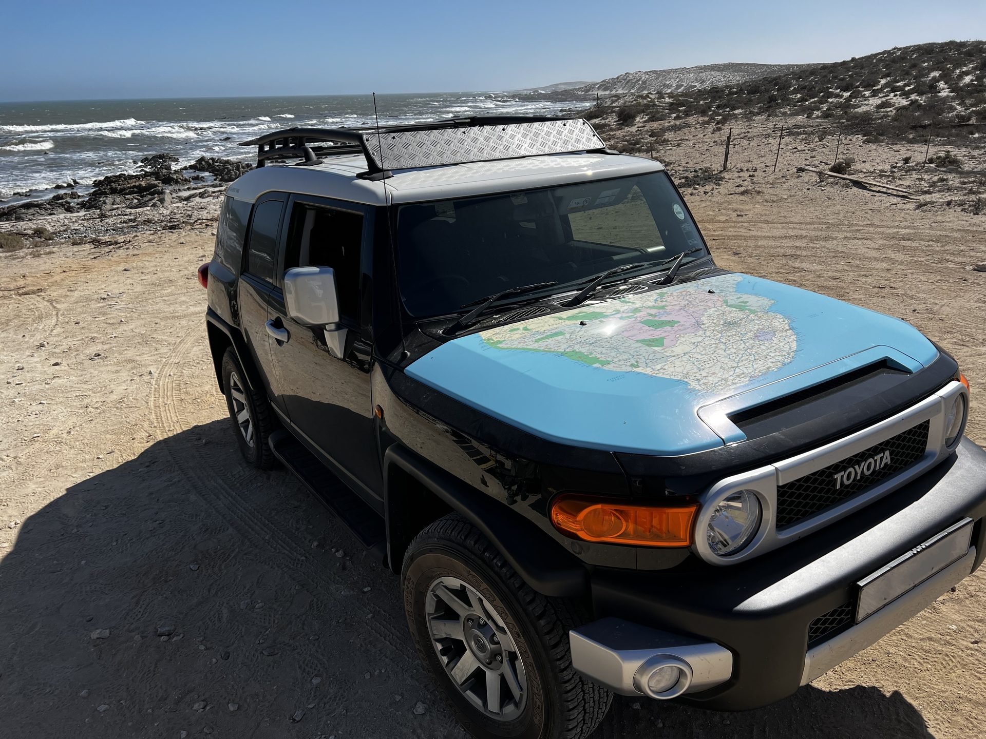 The FJ Cruiser on a coastal track with its expedition gear packed