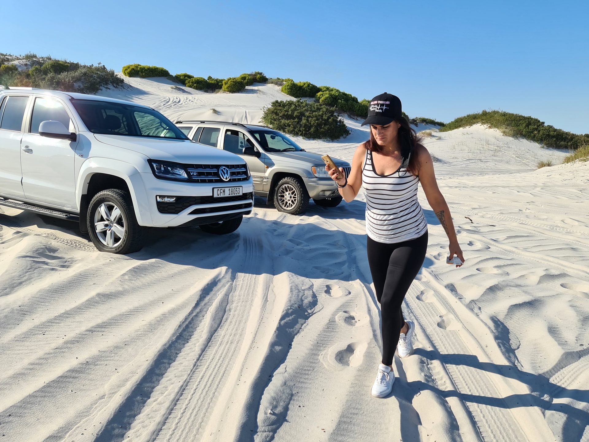 Convoy on the white sand with Table Mountain in the distance