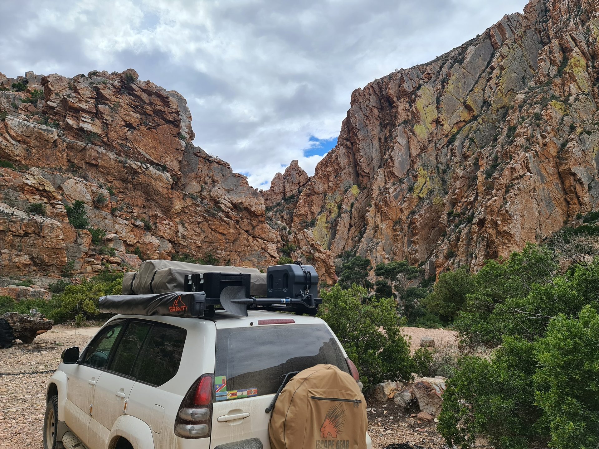 The Prado paused beneath the enormous cliffs of the Swartberg