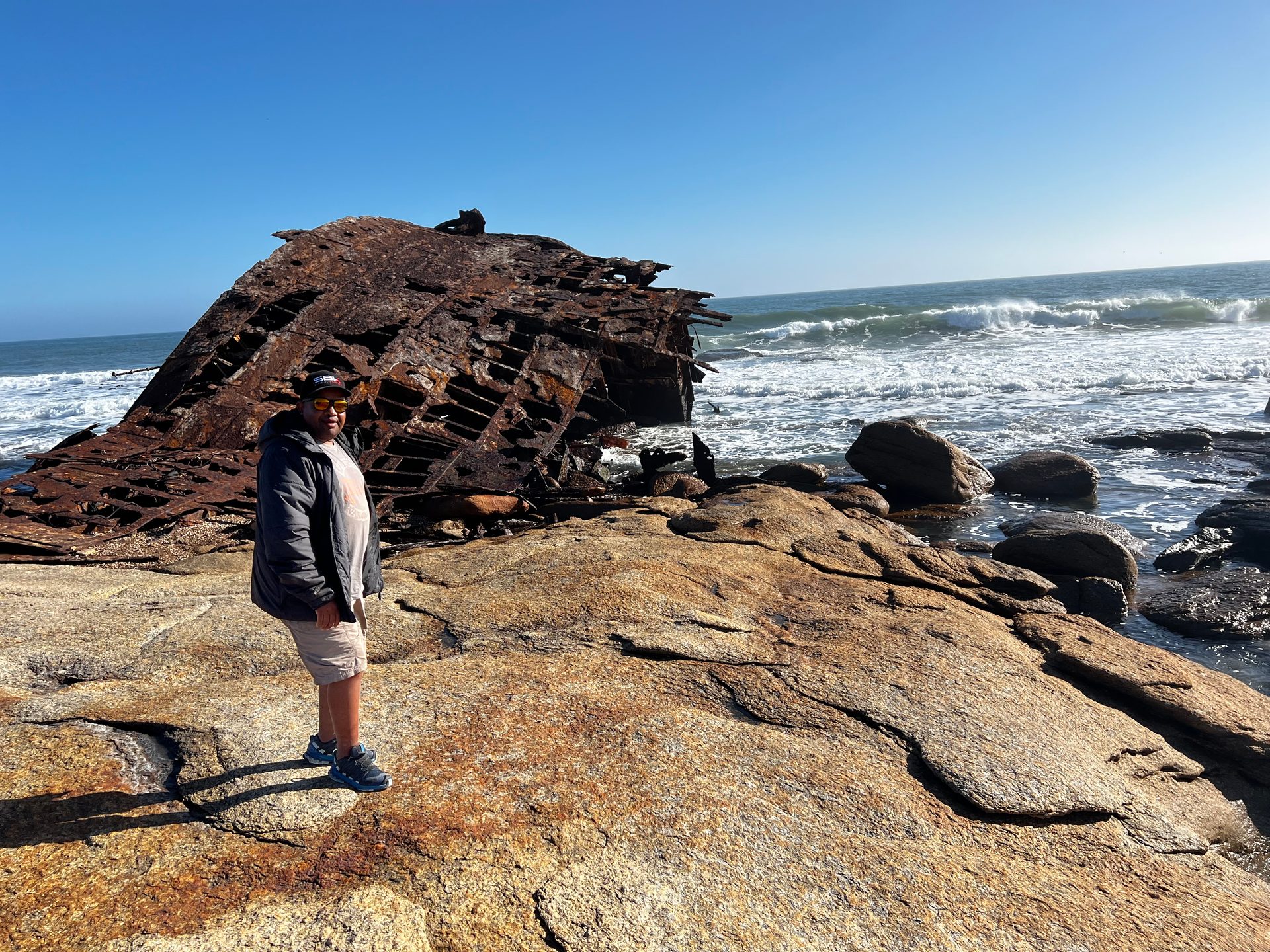 A shipwreck rusting into the West Coast surf