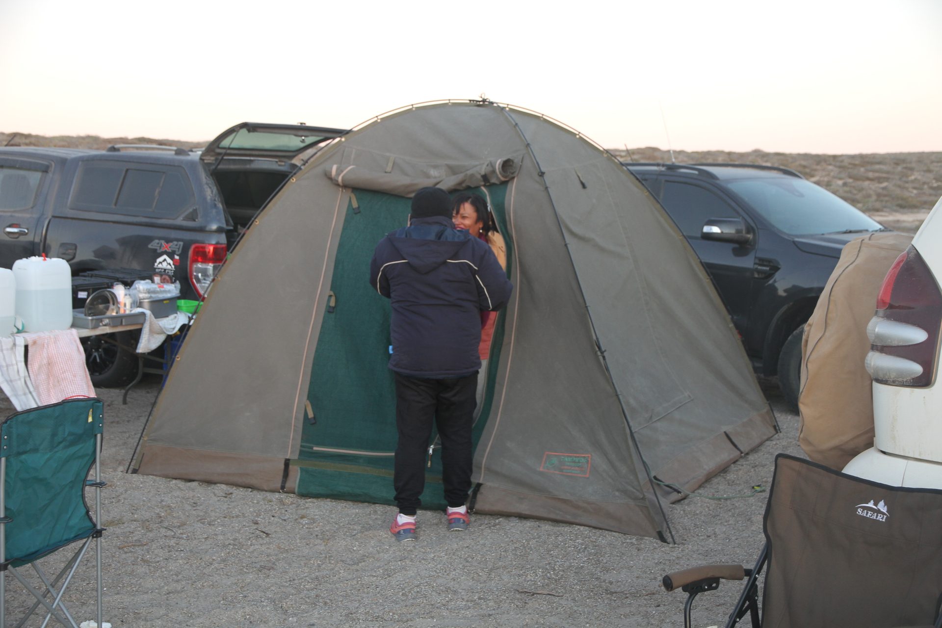 Evening settling over the tents and vehicles