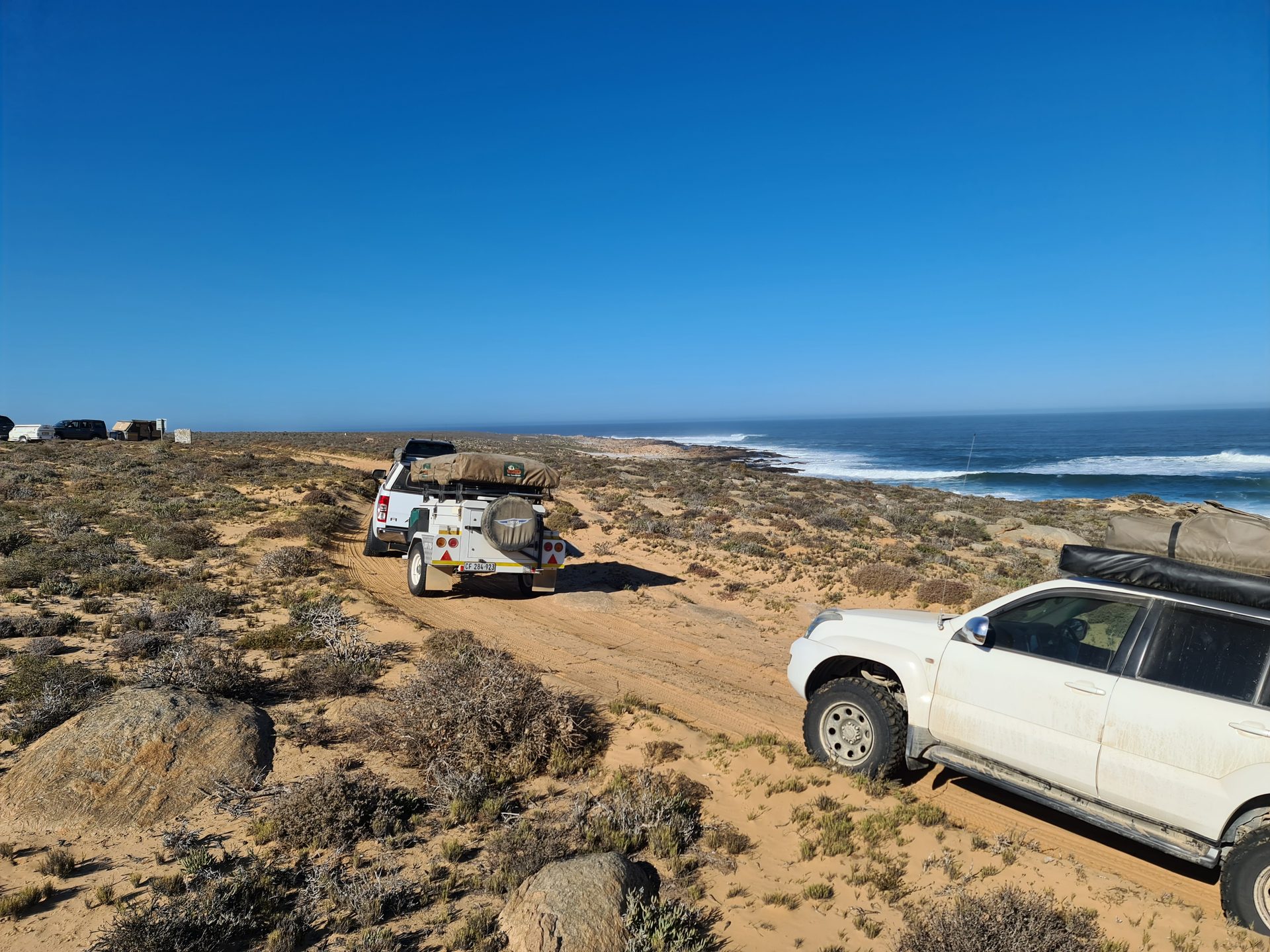 Vehicles descending toward the coast near Groenriviermond