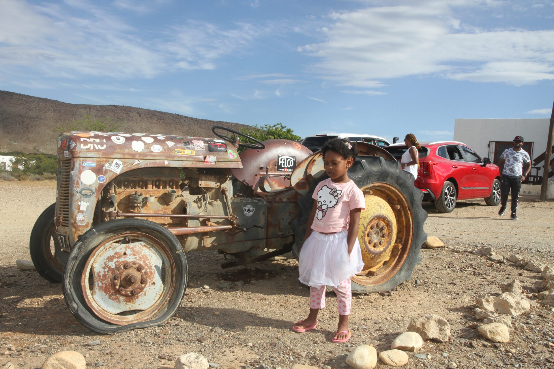 The tractor out front — it fits the place exactly