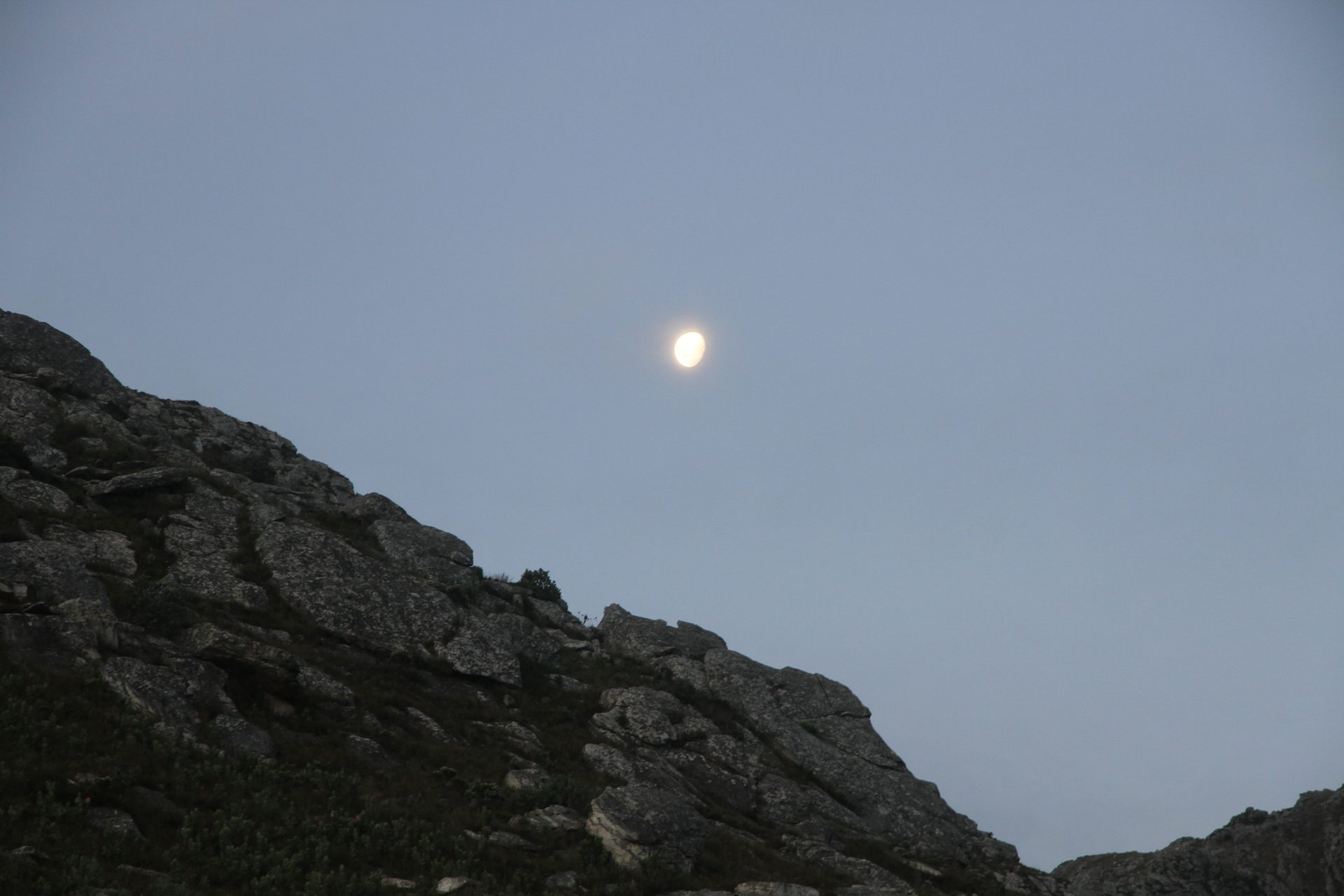 Looking back from the lower switchbacks — the mountain just sits there, indifferent to what hour it is