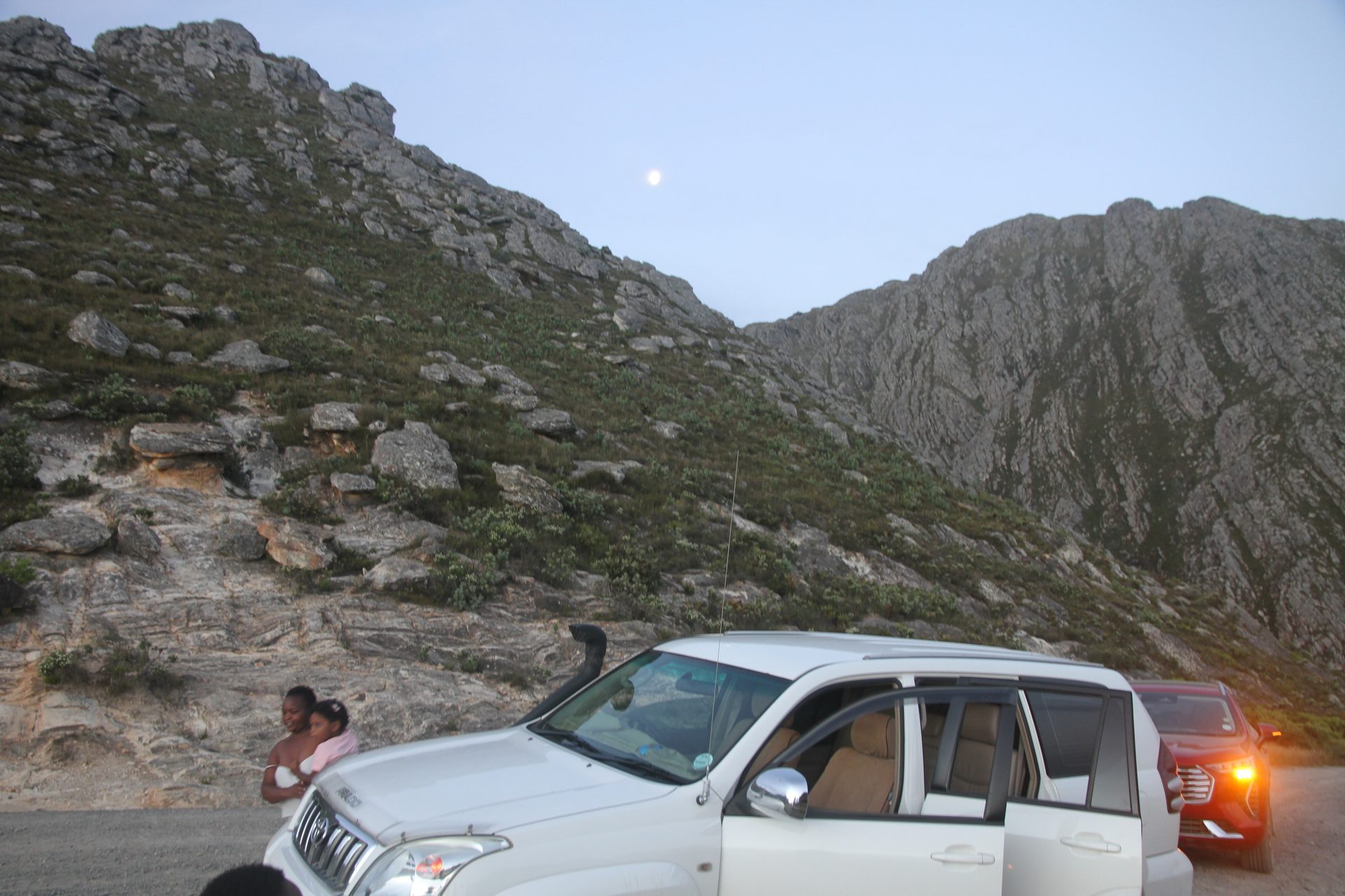 On the Swartberg at night — gravel, rock wall, and fifty metres of headlight