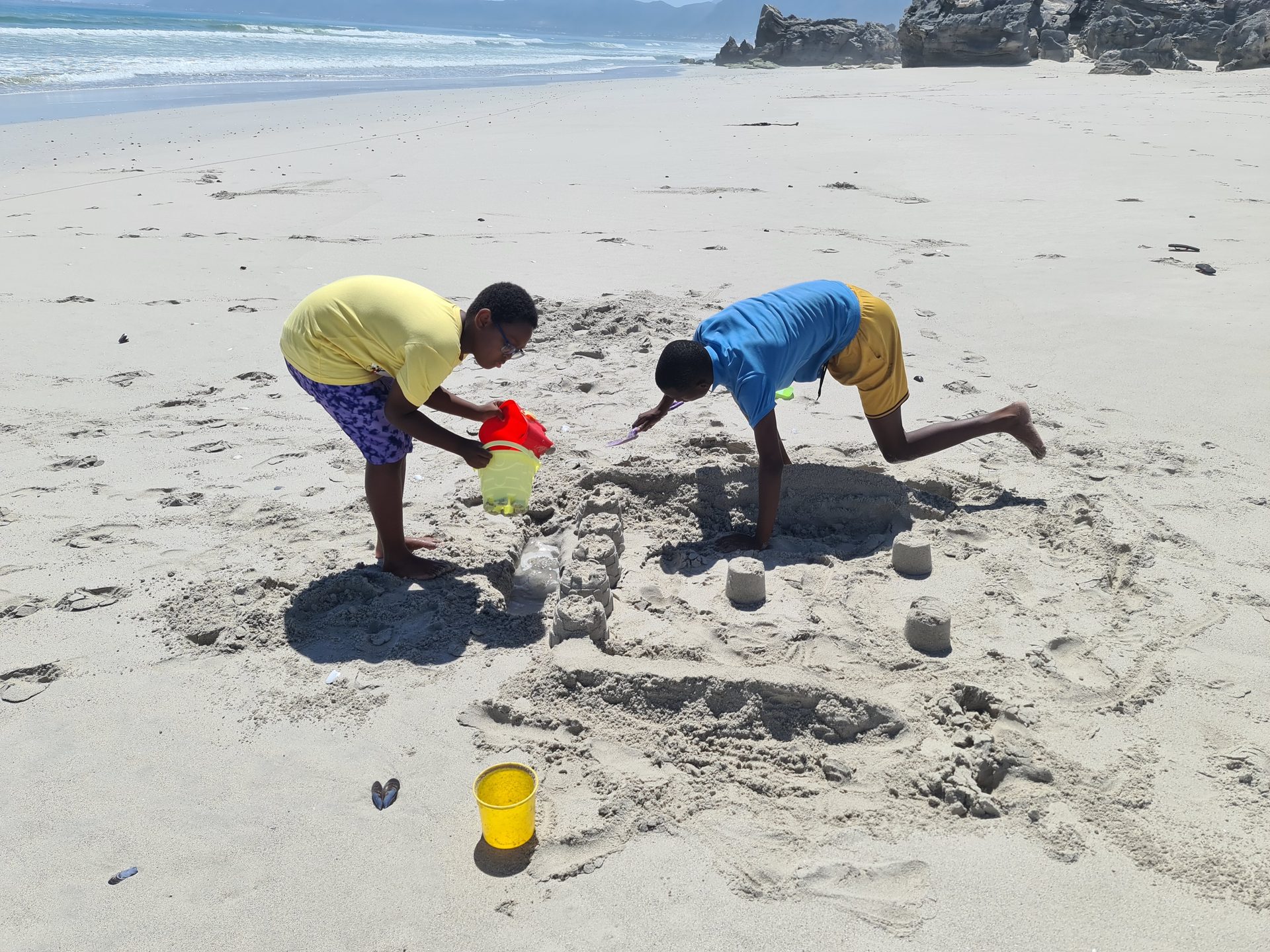 Kids on top of the dune — this is what beach days are supposed to look like