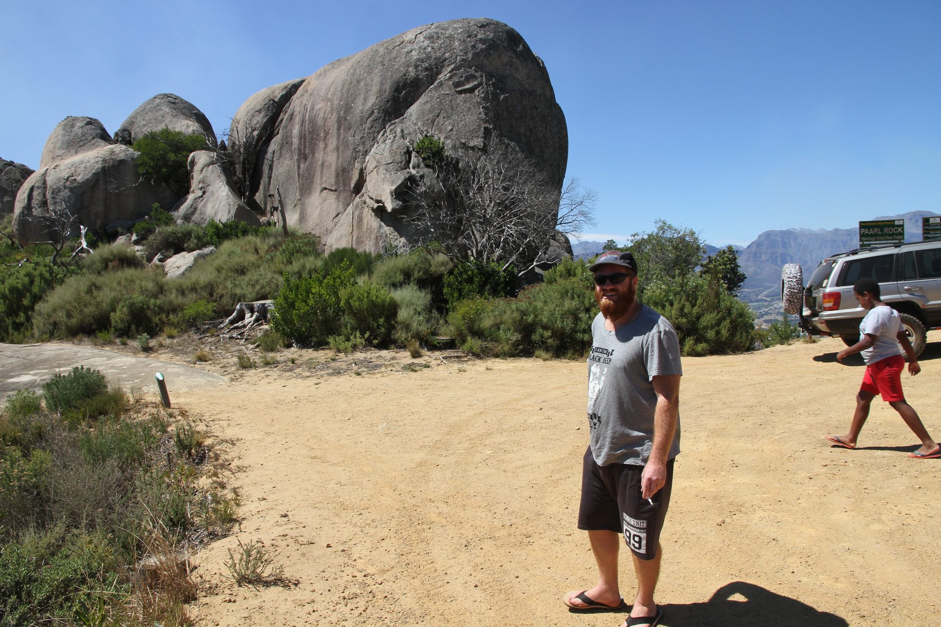 The group making their way up — the rock surface is broader than it looks from the bottom