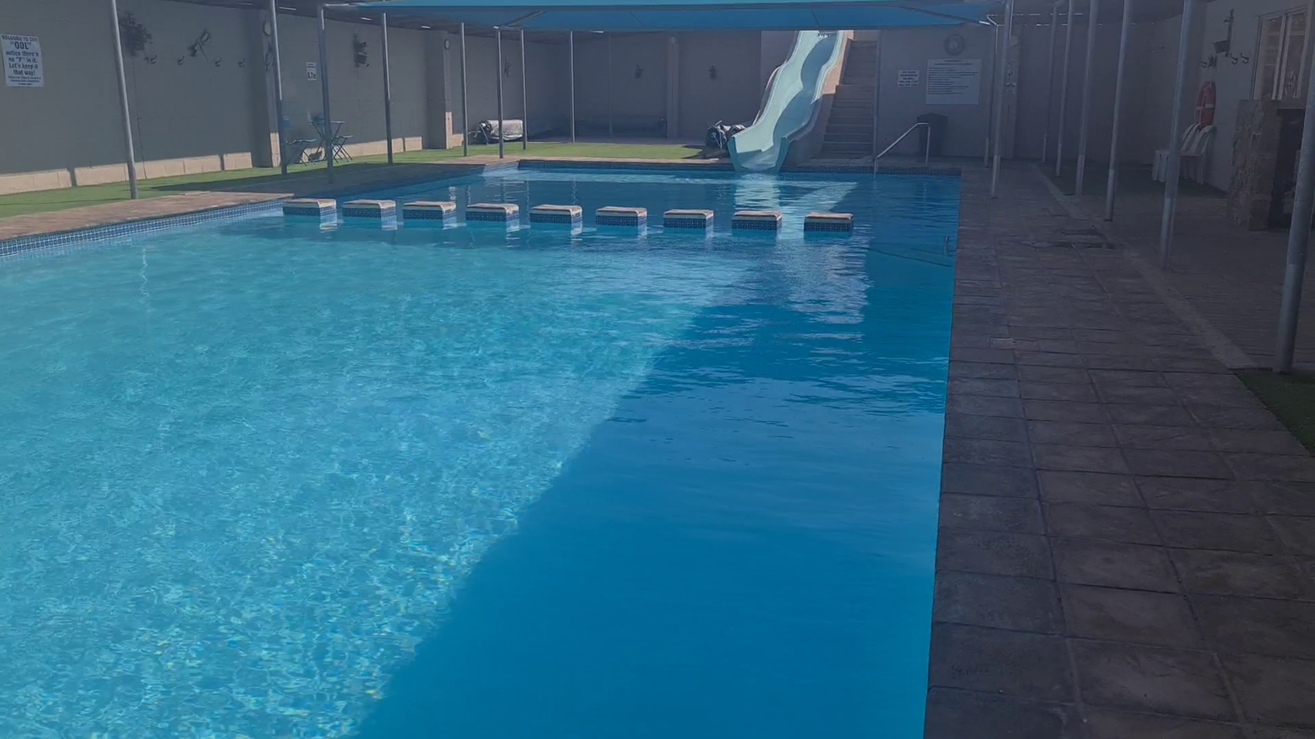 The heated swimming pool and slide at Kleine Paradys