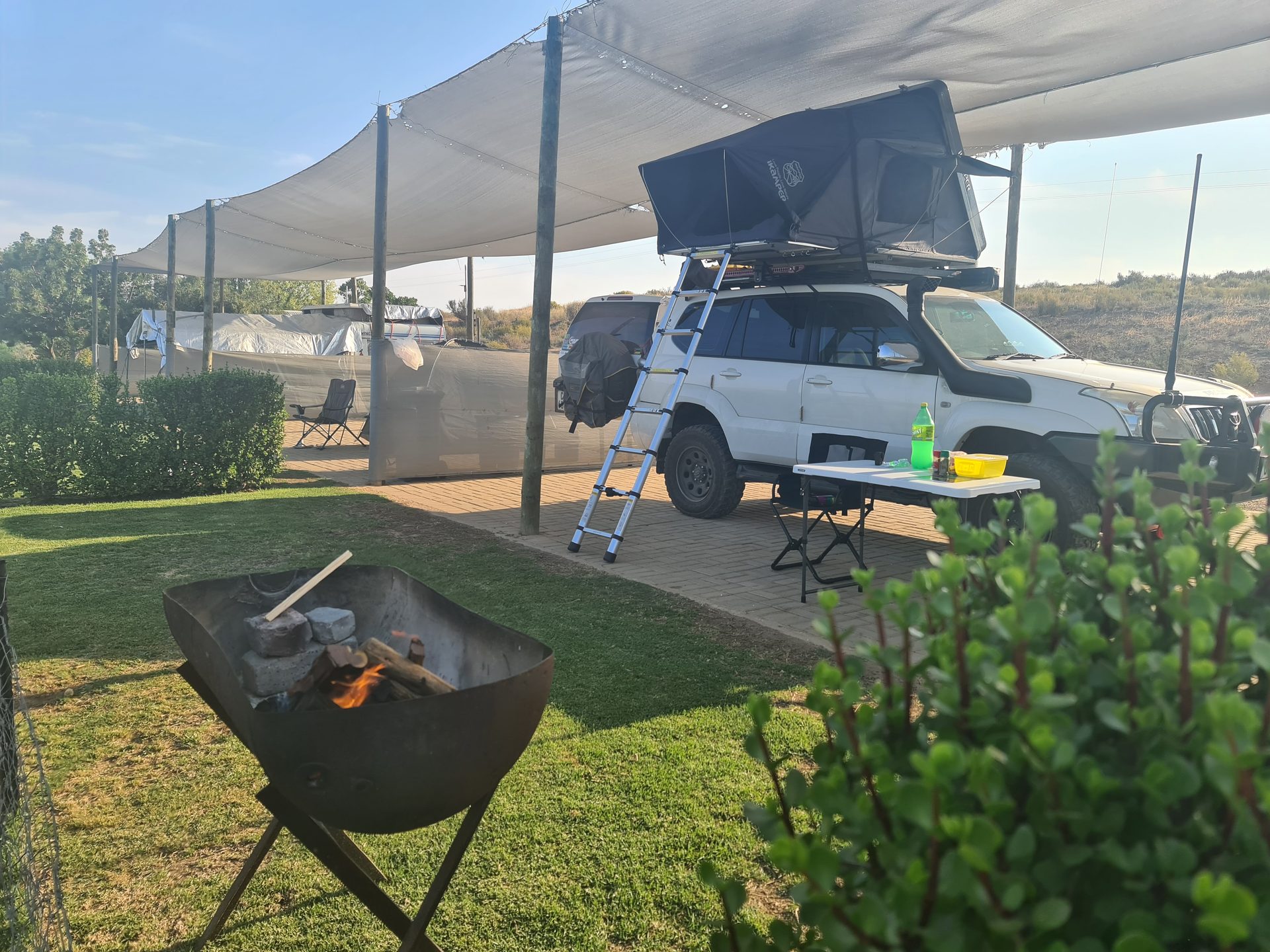 Our rooftop tent set up beneath the shade at Kleine Paradys