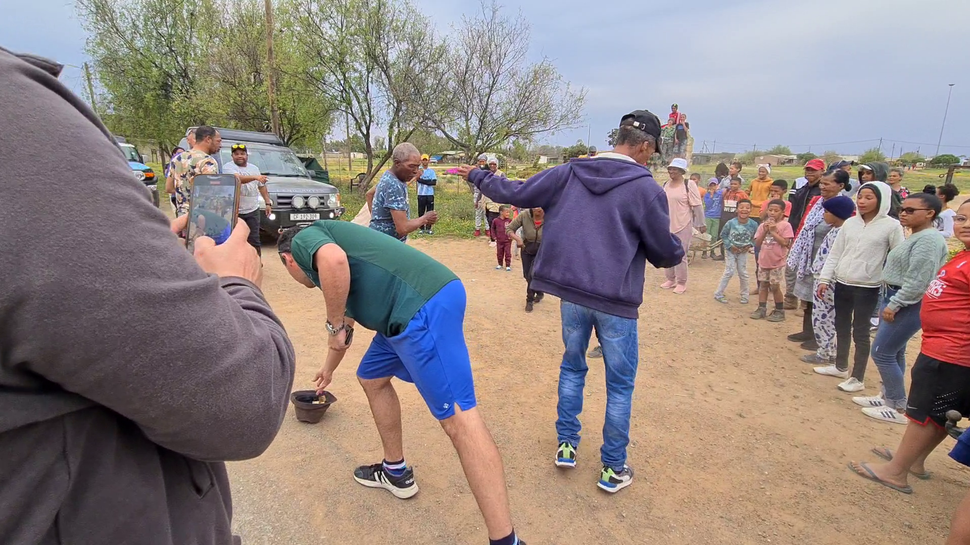 The group joining the community dancing