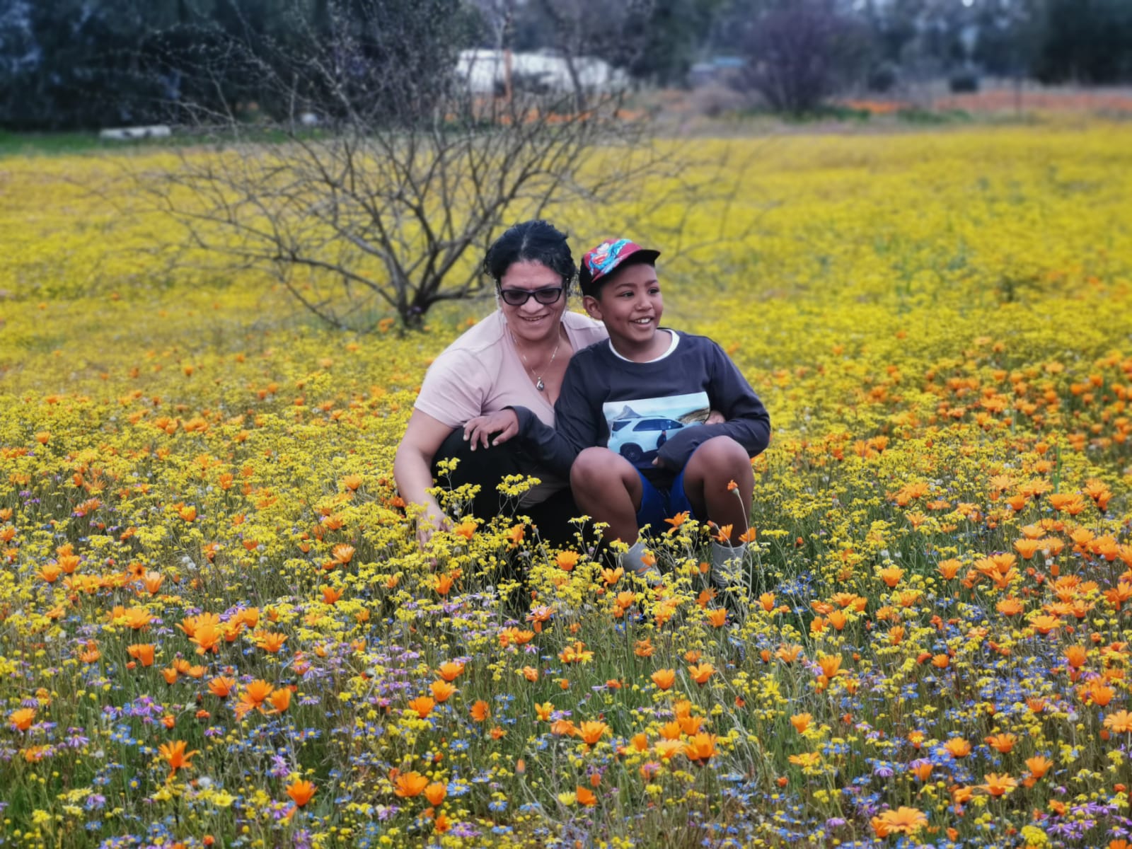 Friends in a field of flowers