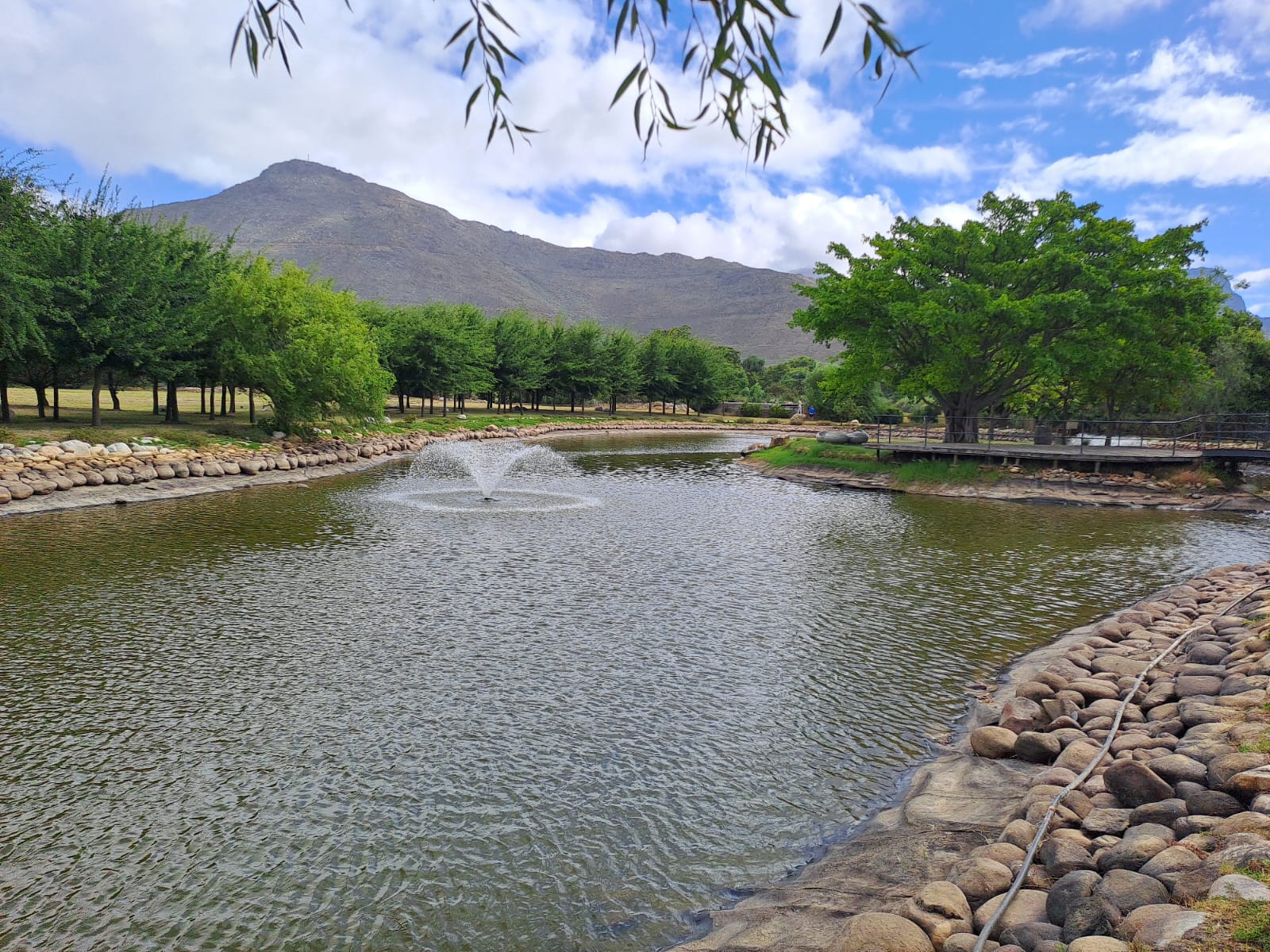 The dam on the estate — mountains, water, and the start of a proper afternoon