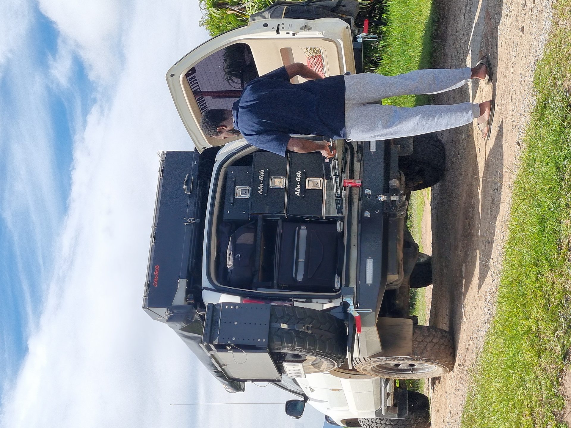 Sarabi parked at the viewpoint with the mountain ridges beyond