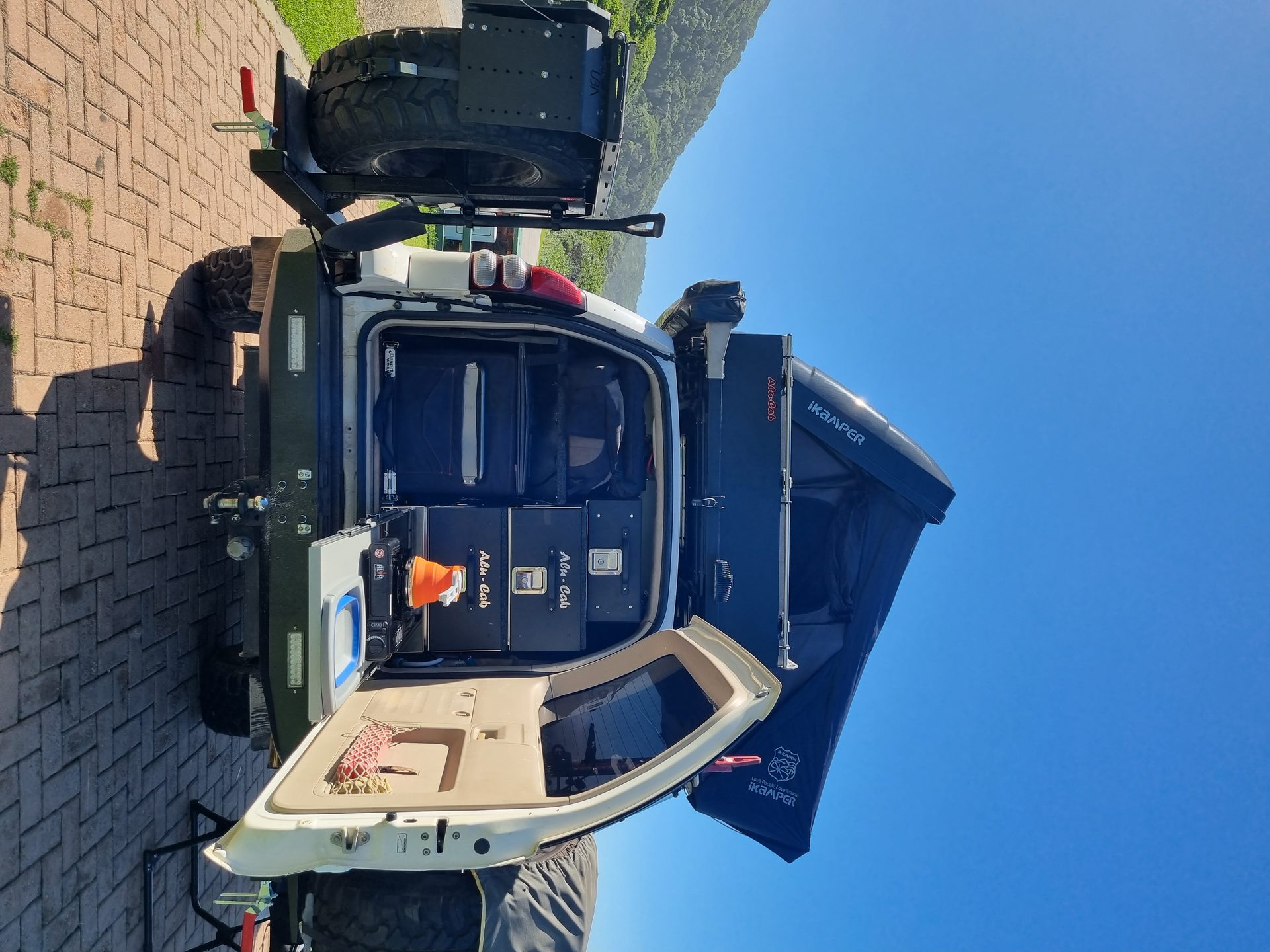 Sarabi’s rooftop camper and rear kitchen set up at camp
