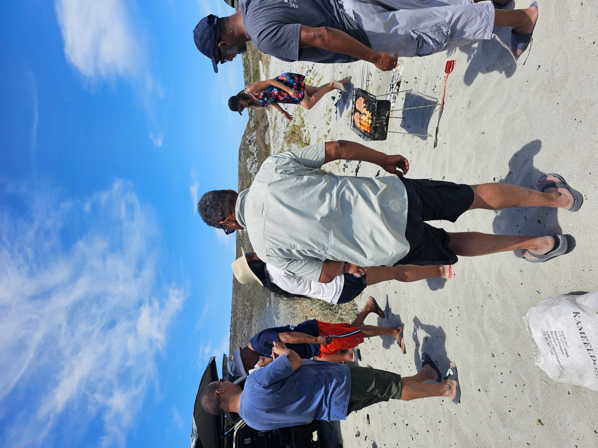 Friends gathering after arriving at the beach