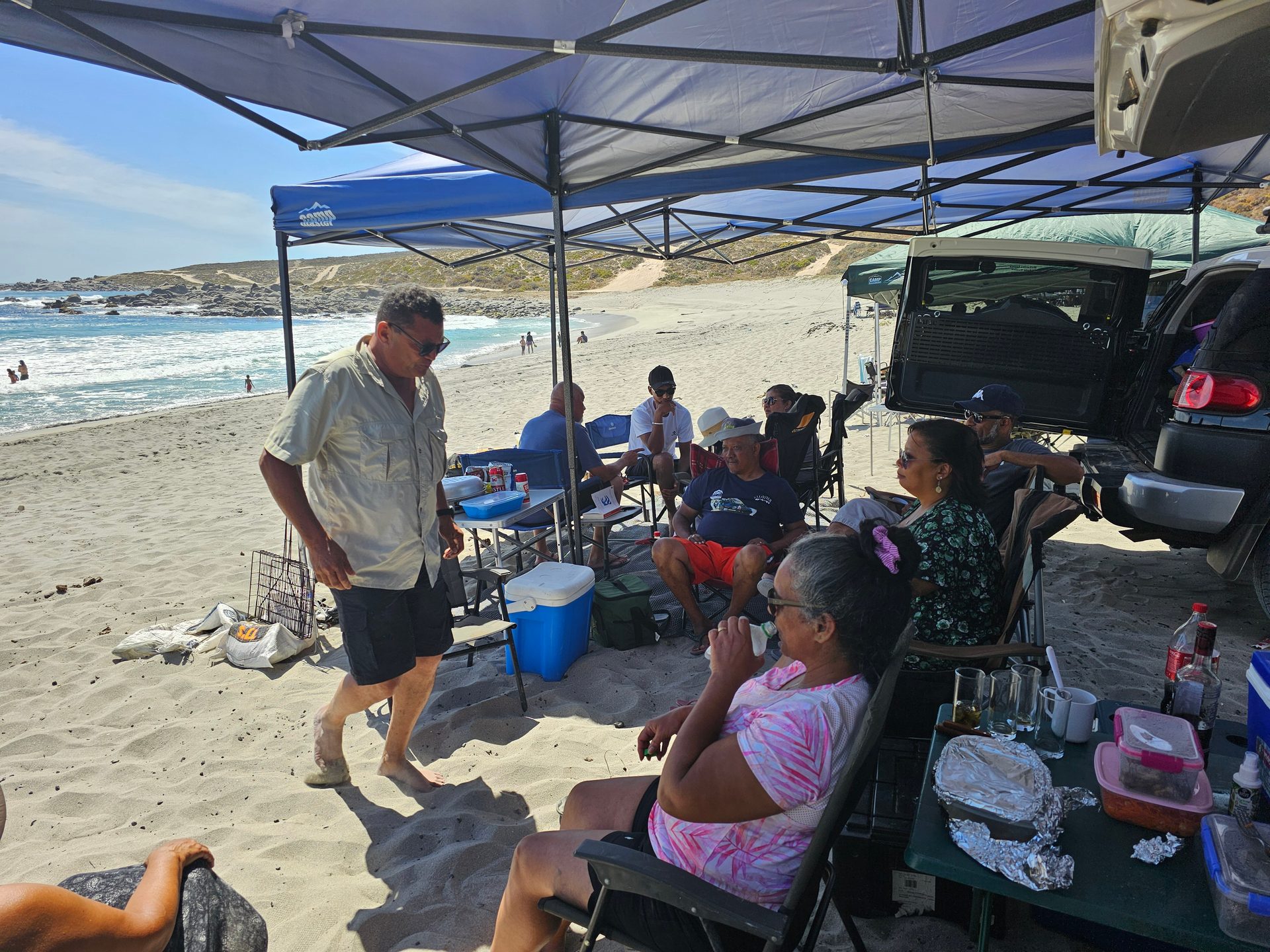 The convoy and camp setup along the coast